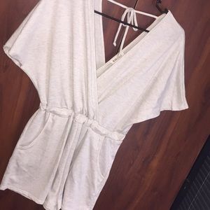 Cream colored short sleeve romper.